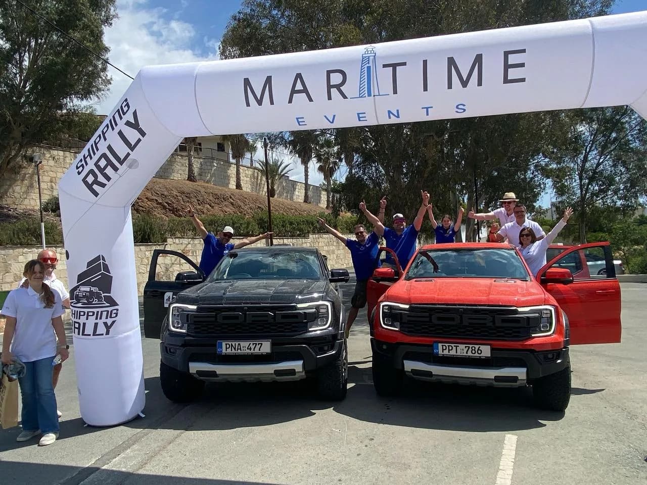The Maritime Events team with two rally pickups under the start arch