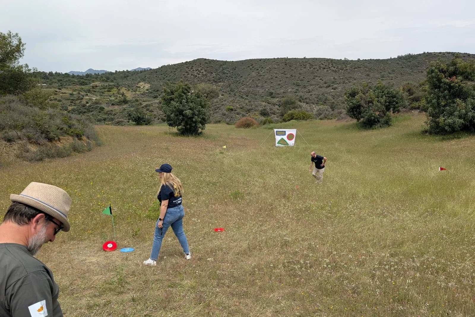 Competitors on a challenge station in an open field