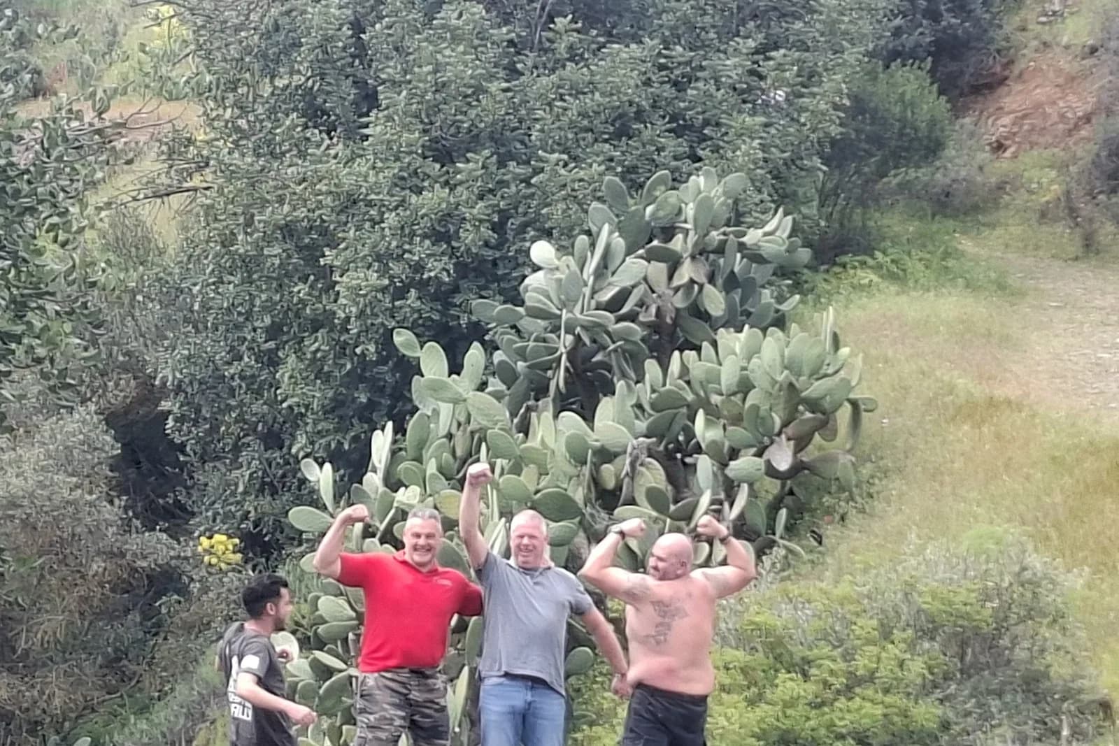 Rally crew flexing for the camera on the old stone bridge